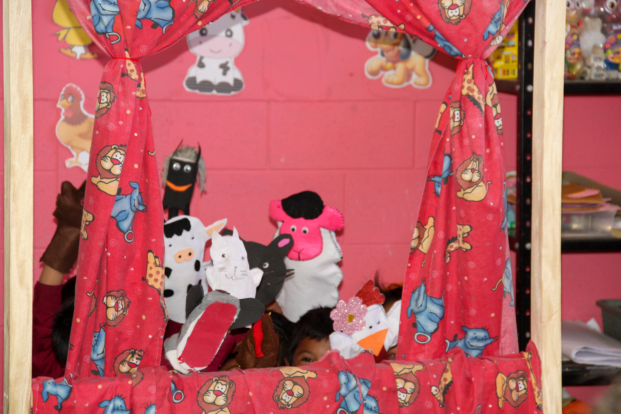 Spark students acting out a story with puppets