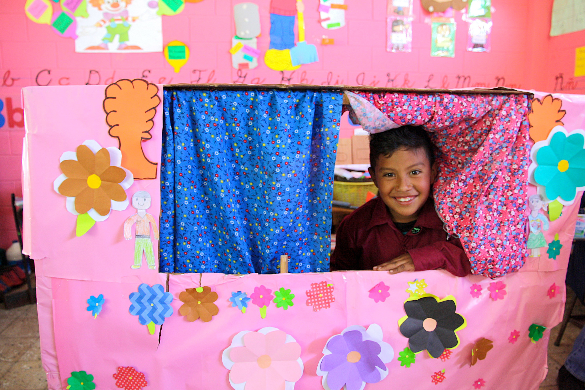 A Spark student showing off the class's puppet theater